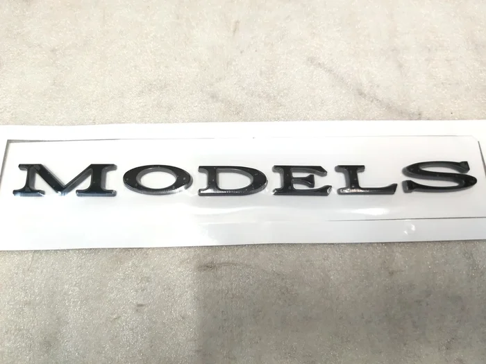 标志“型号”光泽黑色树干盖Tesla Model S，Model S REST 1013738-00-C